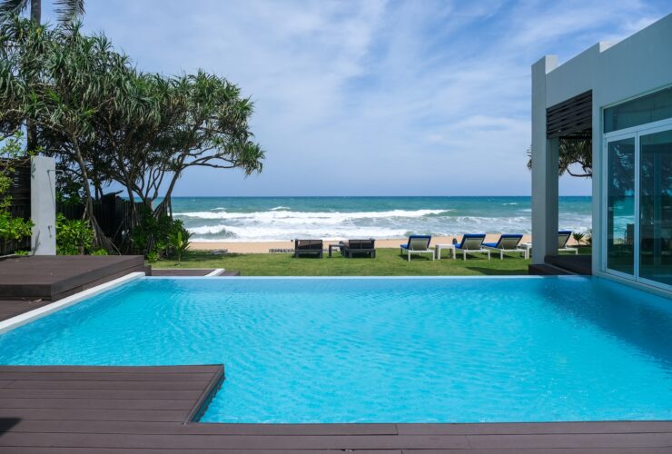 Modern house with a swimming pool, modern pool villa at the beach