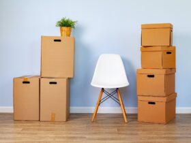 Moving boxes with packed stuff and chair for moving