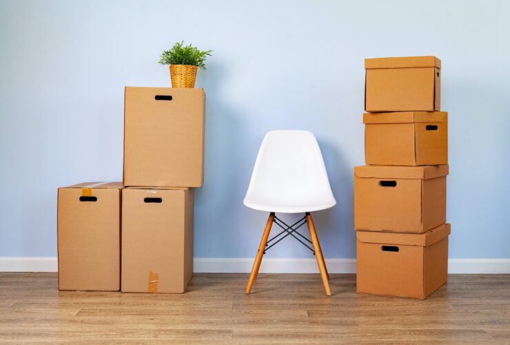 Moving boxes with packed stuff and chair for moving