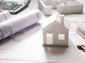 Residential building drawings and house model, Construction concept