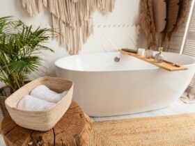 Shot of bathroom with big white bathtub and rustic decor