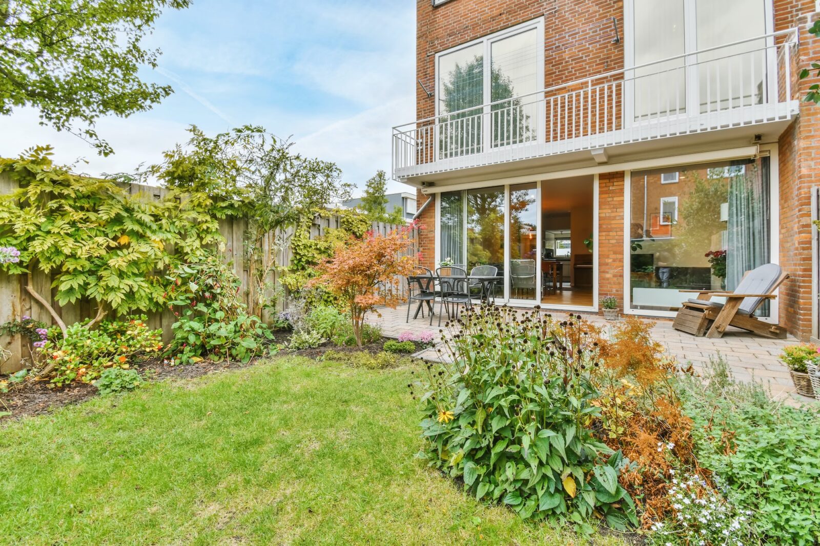 The backyard of a house with a summer dining room
