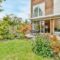 The backyard of a house with a summer dining room