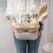 Woman holding basket with cleaning equipment. A woman is doing spring cleaning. The concept of house