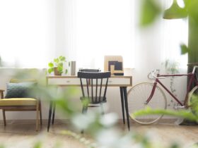 Wooden desk standing by windows