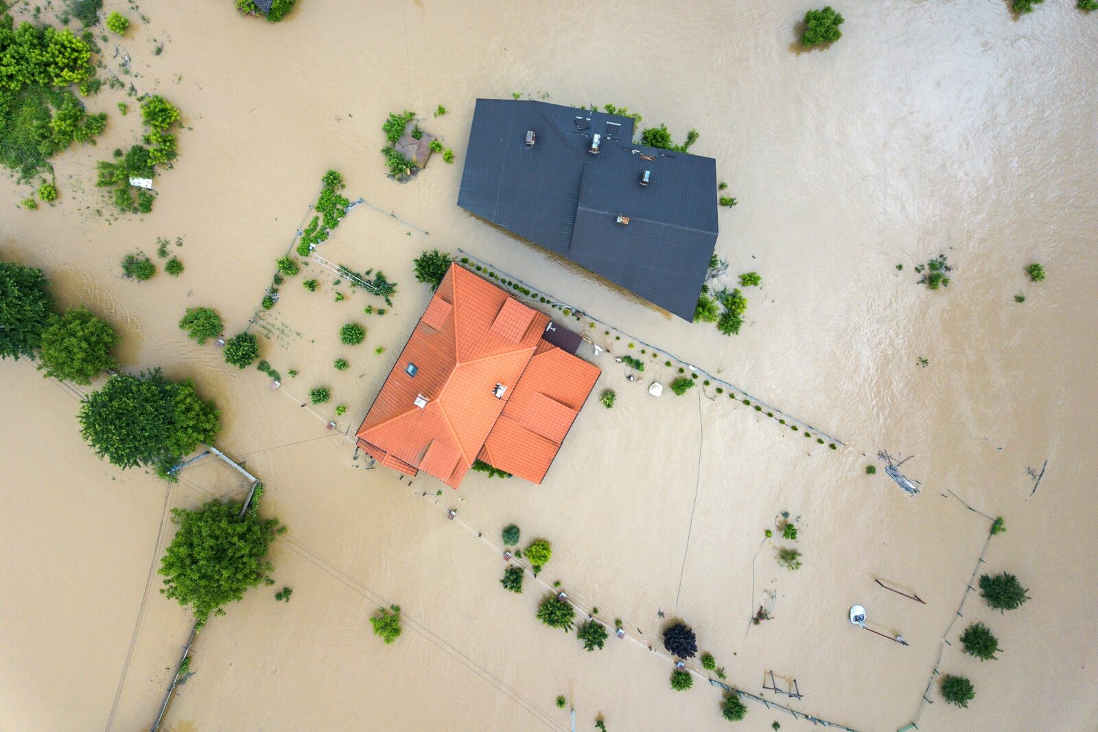 Aerial view of flooded houses with dirty water of Dnister river in Halych town, western Ukraine