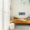 Cute scandinavian style kid's bedroom with single bed