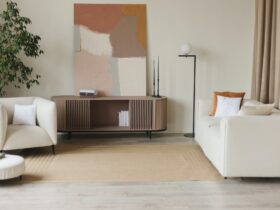 Interior design of stylish living room with modern neutral sofa