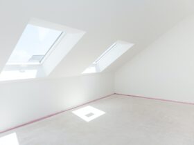 Loft refurbishment - empty room with skylight ready for renovation and new floor