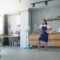 Love the things you do. Full length shot of cheerful young woman, cleaning lady pretending to play