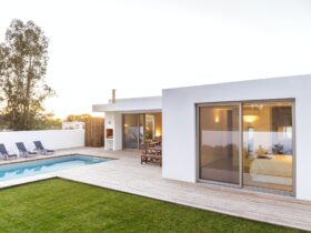 Modern house with garden swimming pool and wooden deck