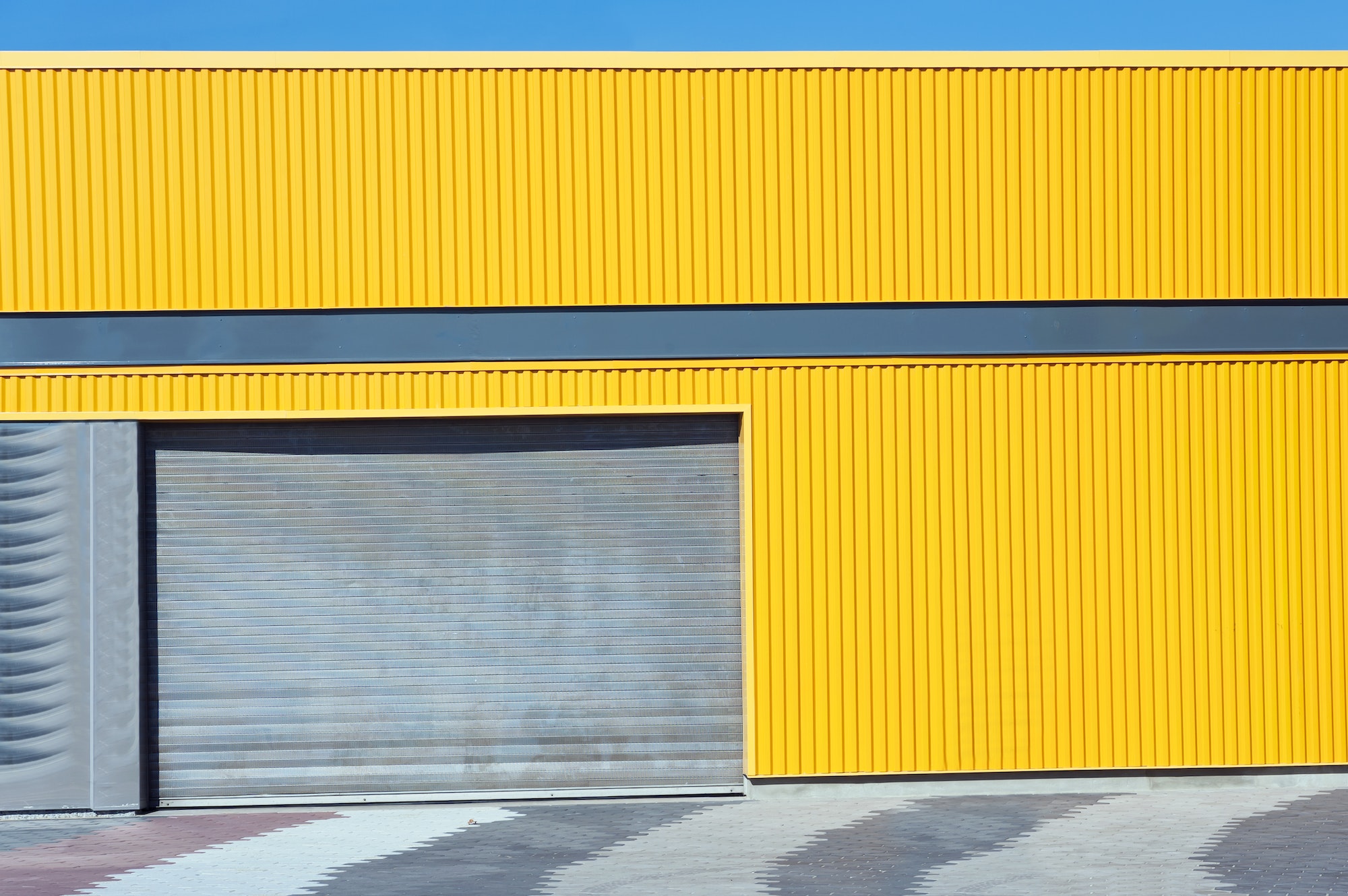 New Modern Garage Door in Unfinish Exterior Yellow Metal Wall