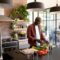 Serious african american senior man cooking in kitchen
