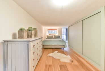 Small bedroom with wooden furniture