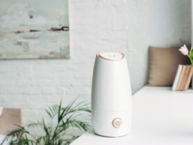 white humidifier standing on windowsill at home