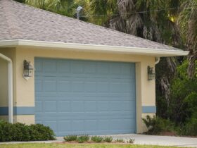 Wide garage double door and concrete driveway of new modern american house