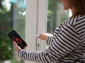 Woman Setting Home Security System