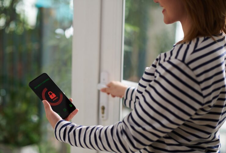 Woman Setting Home Security System