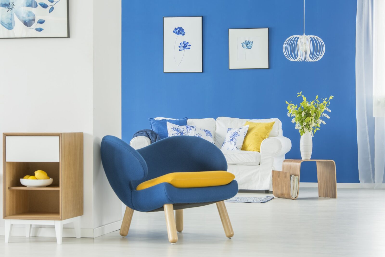 Yellow accents in blue room