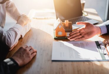 Business Signing a Contract Buy - sell house.