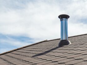 Chimney pipe from stainless steel on the roof of the house