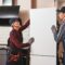 Moving again. Young men mechanics moving refrigerator