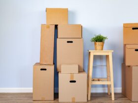 Moving boxes with packed stuff and chair for moving