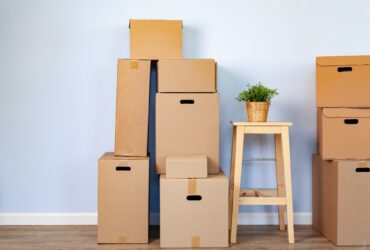 Moving boxes with packed stuff and chair for moving
