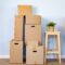 Moving boxes with packed stuff and chair for moving