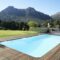Outdoor Swimming Pool Surrounded With Wooden Decking