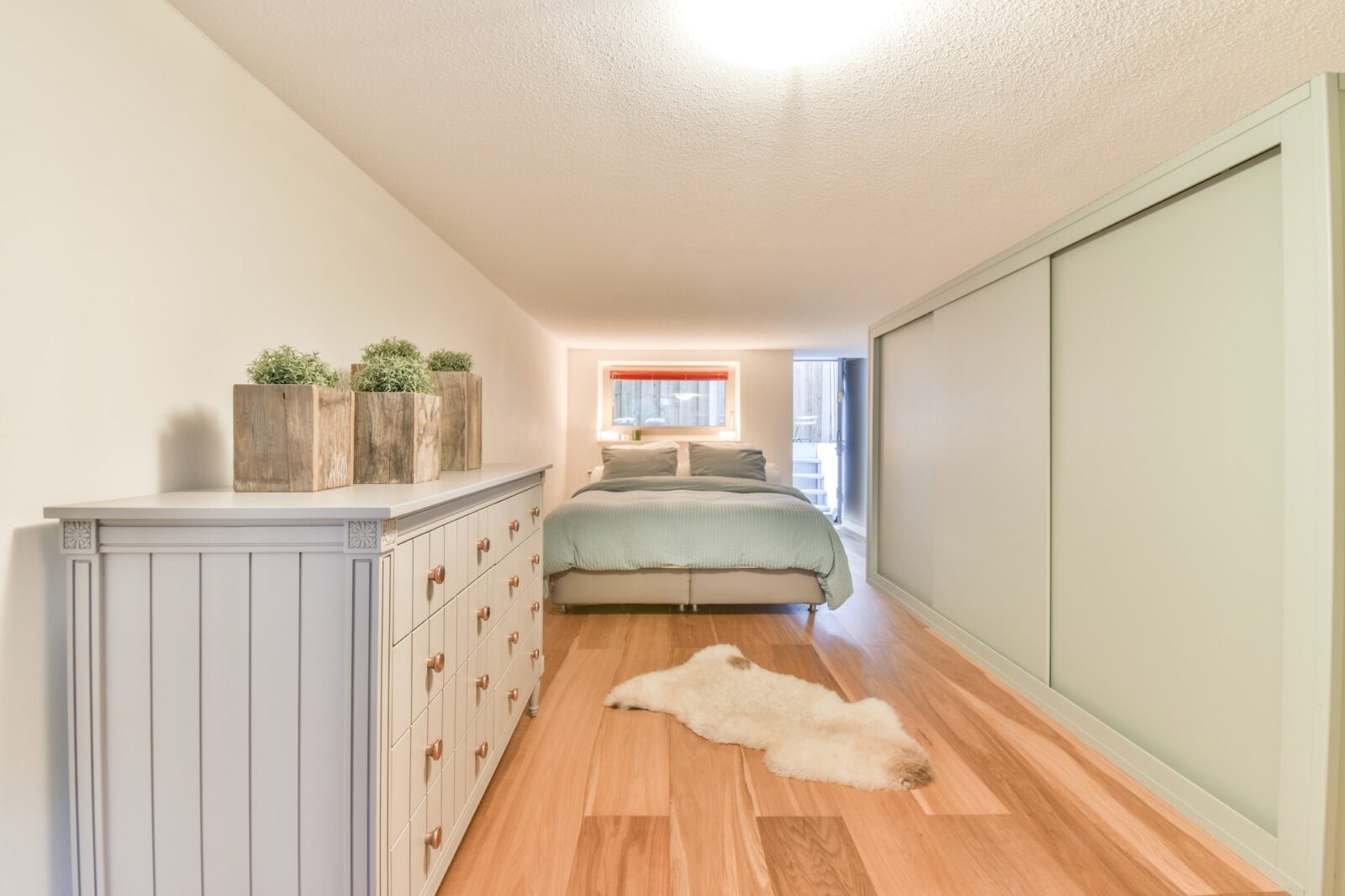 Small bedroom with wooden furniture