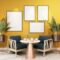 Stylish interior design of dining room with table chair, tropical plant in ceramic pot