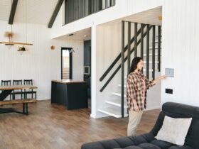Young woman looking at home security panel or screen