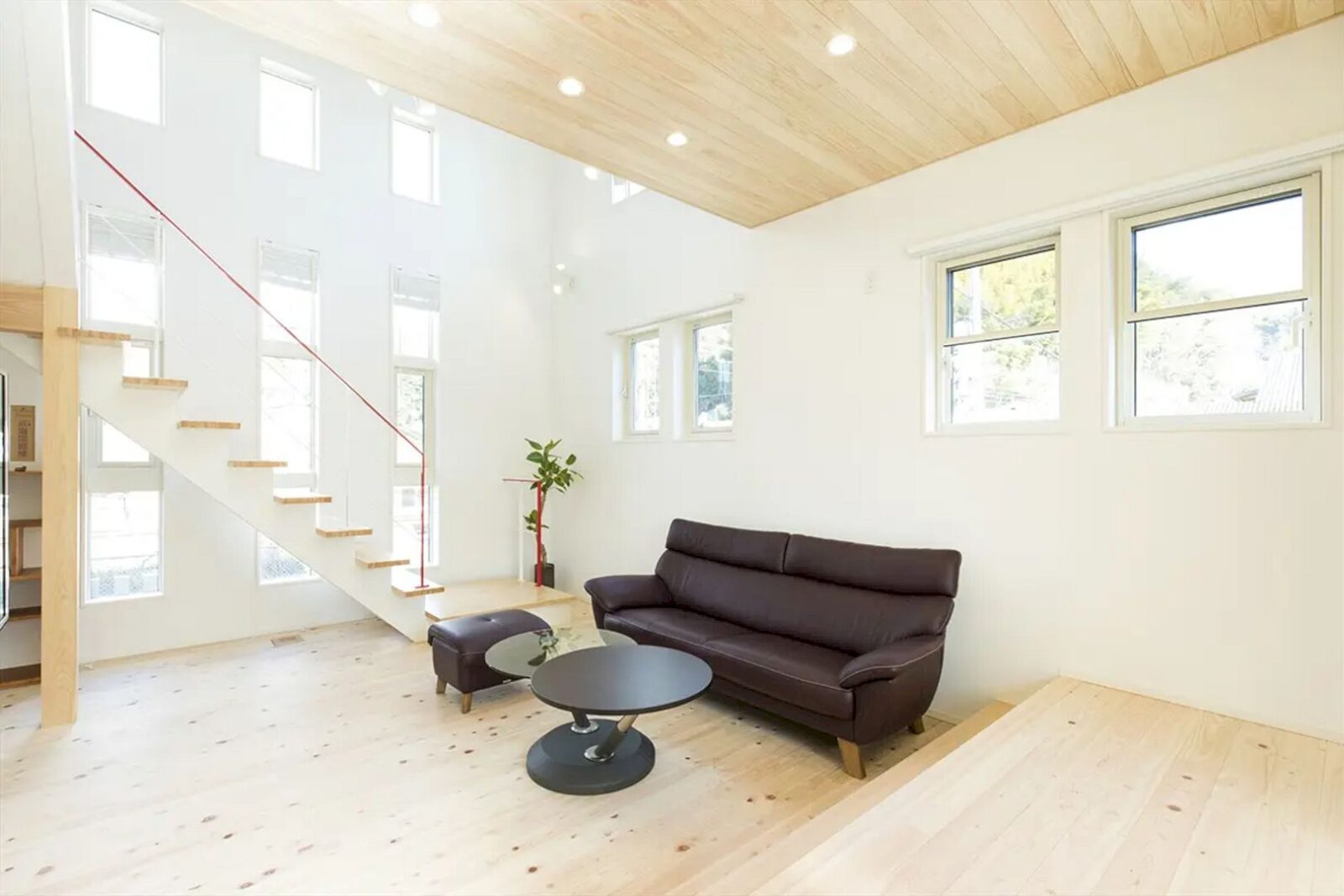 A Modern Japanese House With A Red Handrail On The Living Room Stairs 5