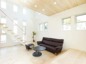 A Modern Japanese House With A Red Handrail On The Living Room Stairs 5