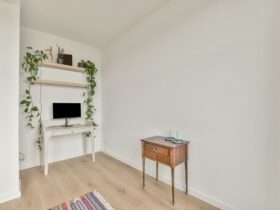 A small space with a monitor on the table