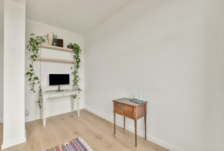 A small space with a monitor on the table