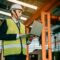 Businessman engineer using software virtual reality in laptop to monitoring machine in real time.
