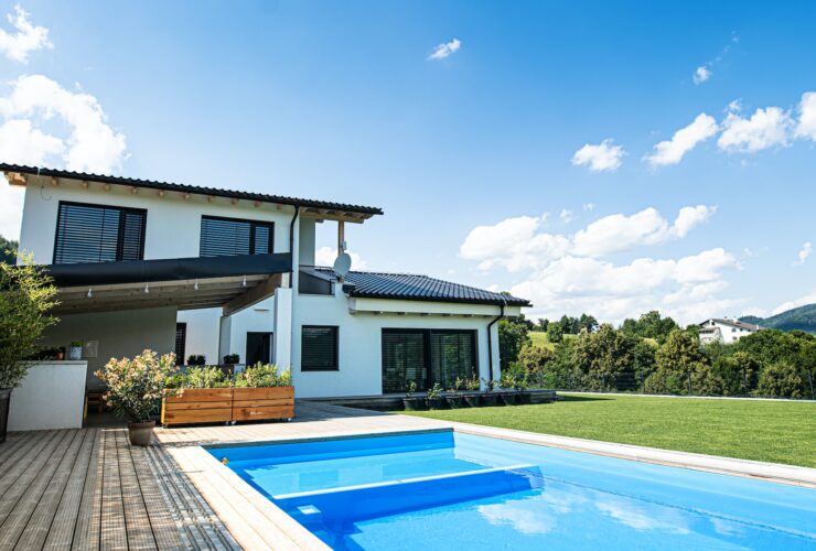 House with swimming pool outdoors in backyard garden