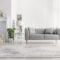Plants and carpet in white living room interior with candles nex