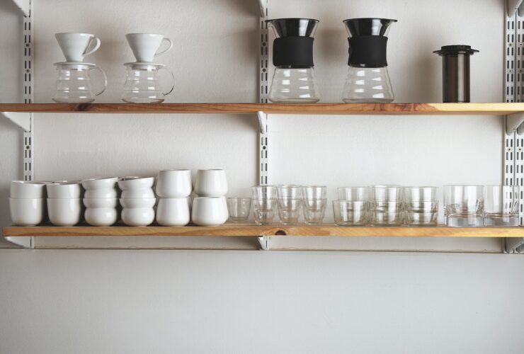 Shelves with glasses and coffee makers
