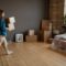 Woman Bringing Boxes Into To New House