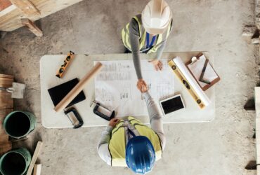 Architect, handshake and thank you for construction, blueprint and collaboration on building design