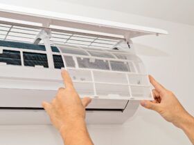 Changing the filter of the air conditioner. Changing filter in air conditioning.