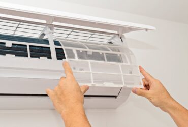 Changing the filter of the air conditioner. Changing filter in air conditioning.