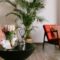 Flower on the table in stylish living room.