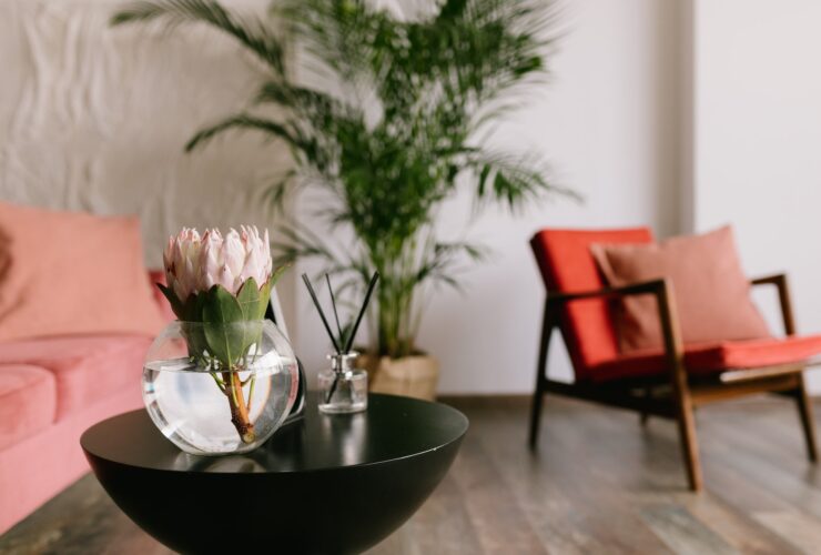 Flower on the table in stylish living room.
