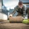 Landscaper Installing Natural Grass Turf