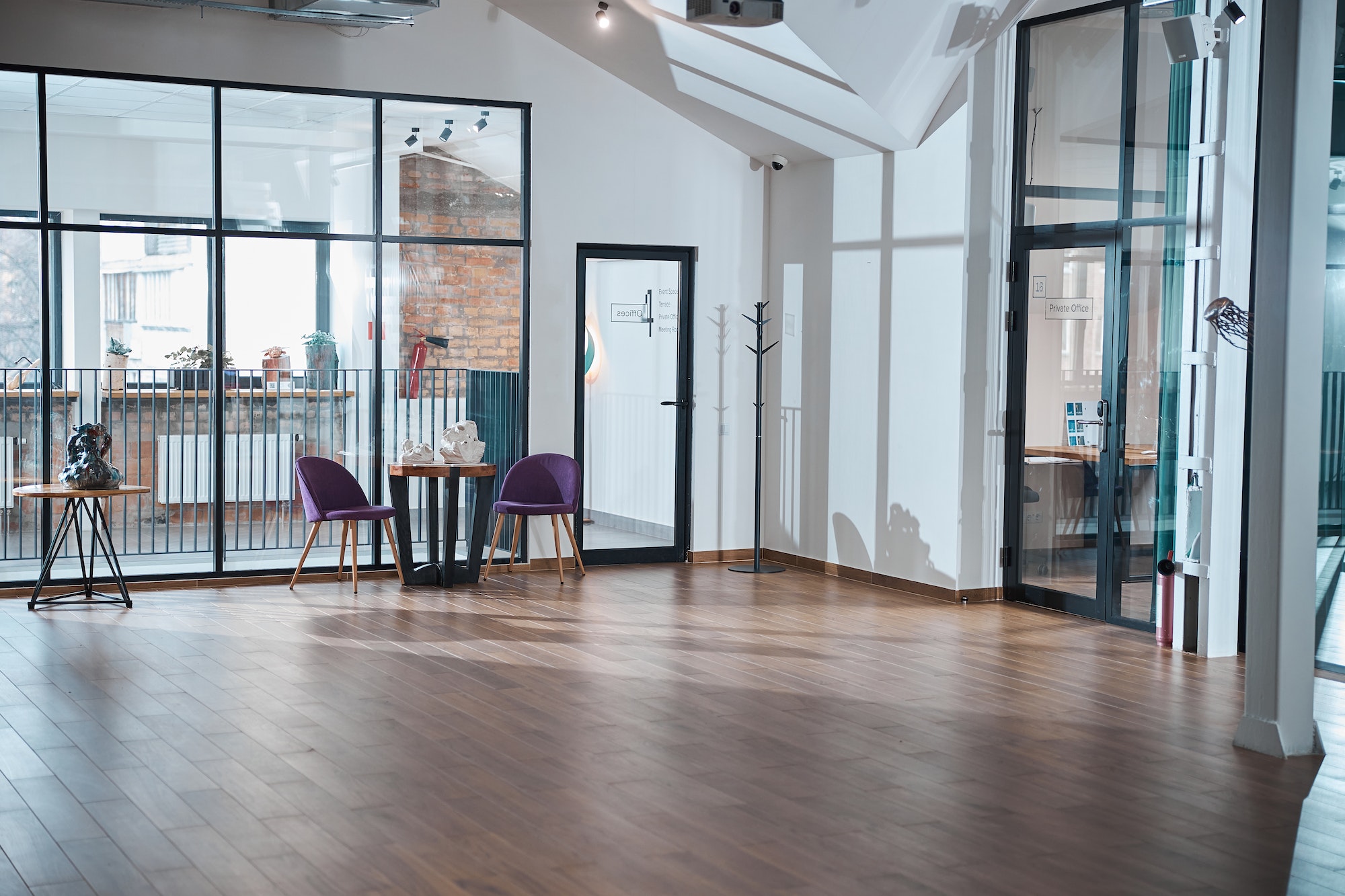 Modern empty office room with wooden floor