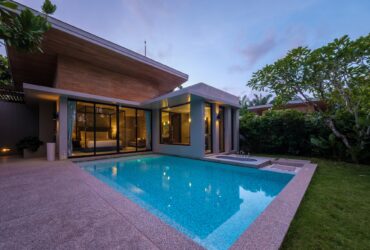 Modern house with a swimming pool, modern pool villa at the beach